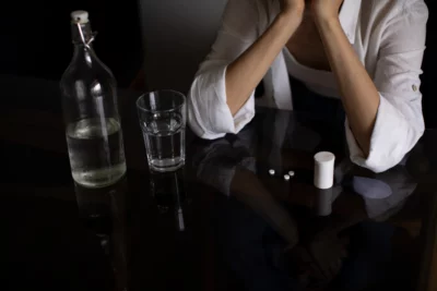 Woman in table with Zoloft and Beear