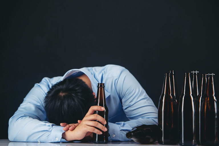 man drinking a lot of beers