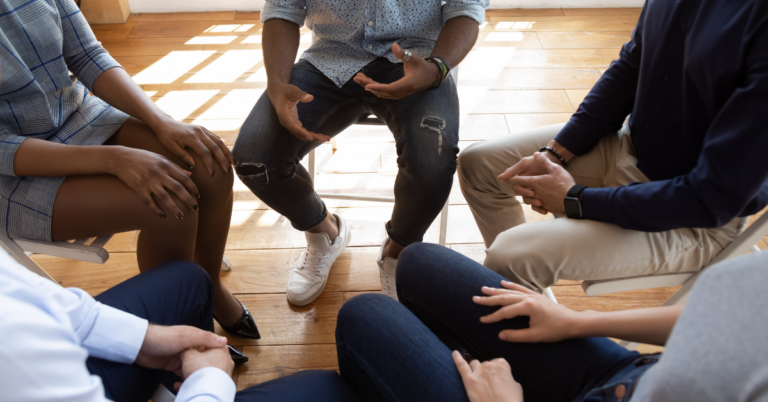 group of people sitting in a circle