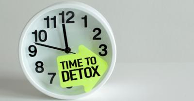 A clock that says "time to detox"