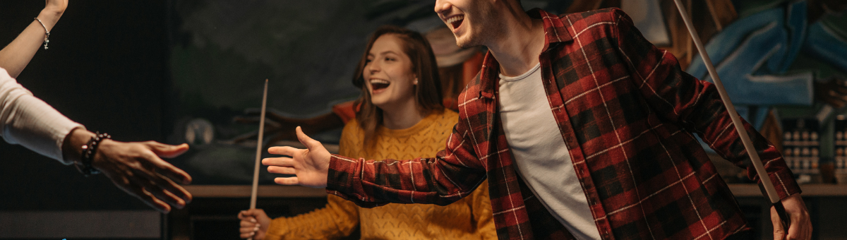 People having fun while playing pool, no alcohol in sight.